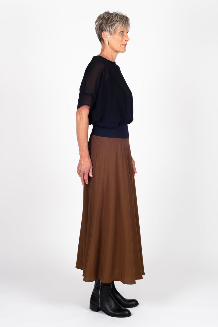 Tall model wearing Paris Skirt Cinnamon side right