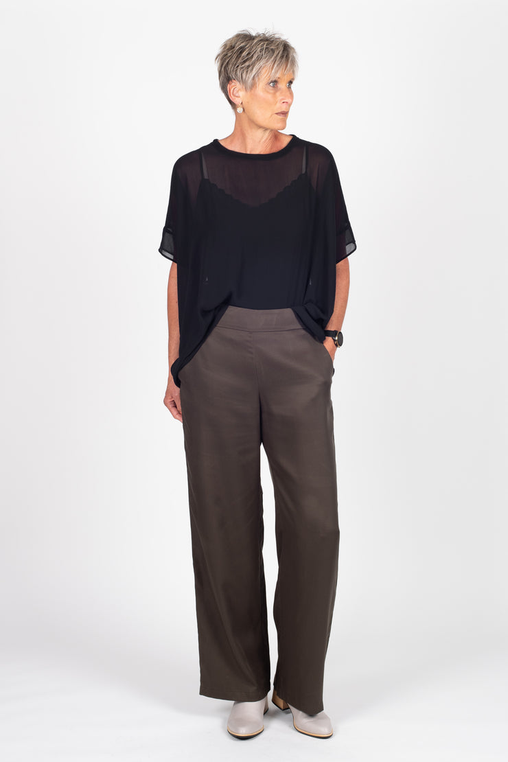 Tall model wearing Celine Pants Grey Check, front