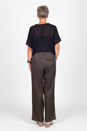 Tall model wearing Celine Pants Khaki, back