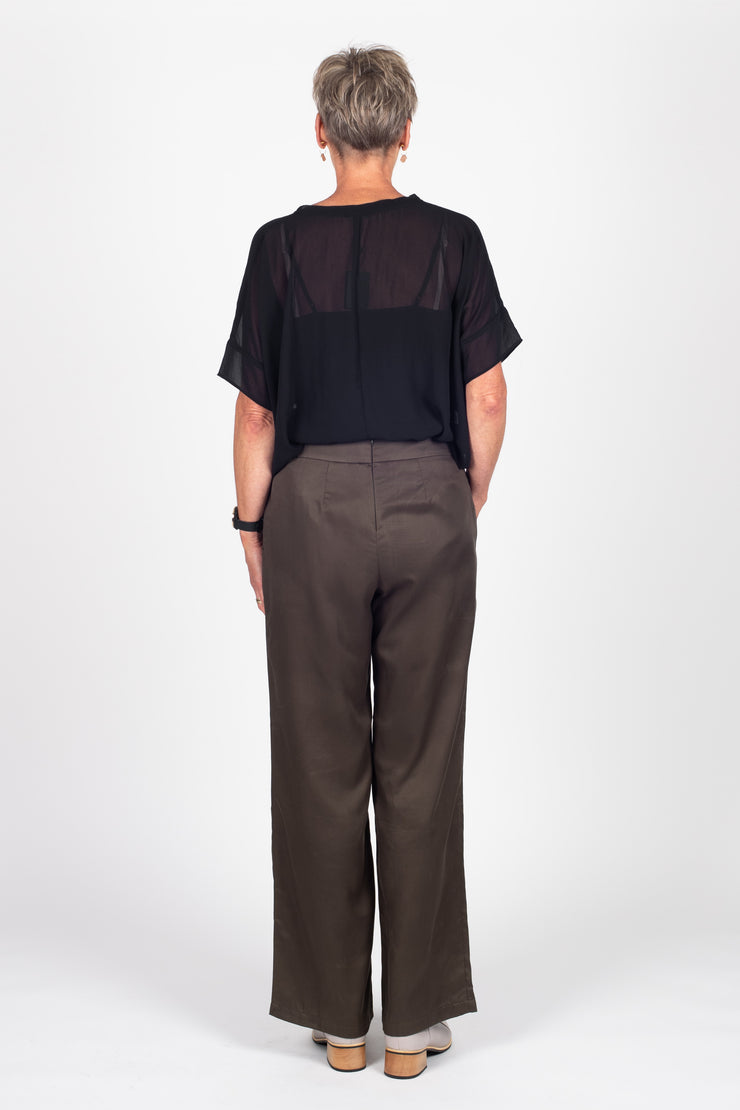 Tall model wearing Celine Pants Khaki, back