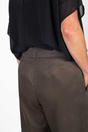 Tall model wearing Celine Pants Khaki, back close up