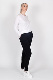Tall model wearing Freida Pants Black, side