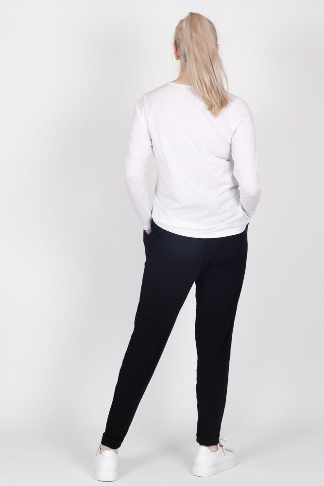 Tall model wearing Freida Pants Black, back 2