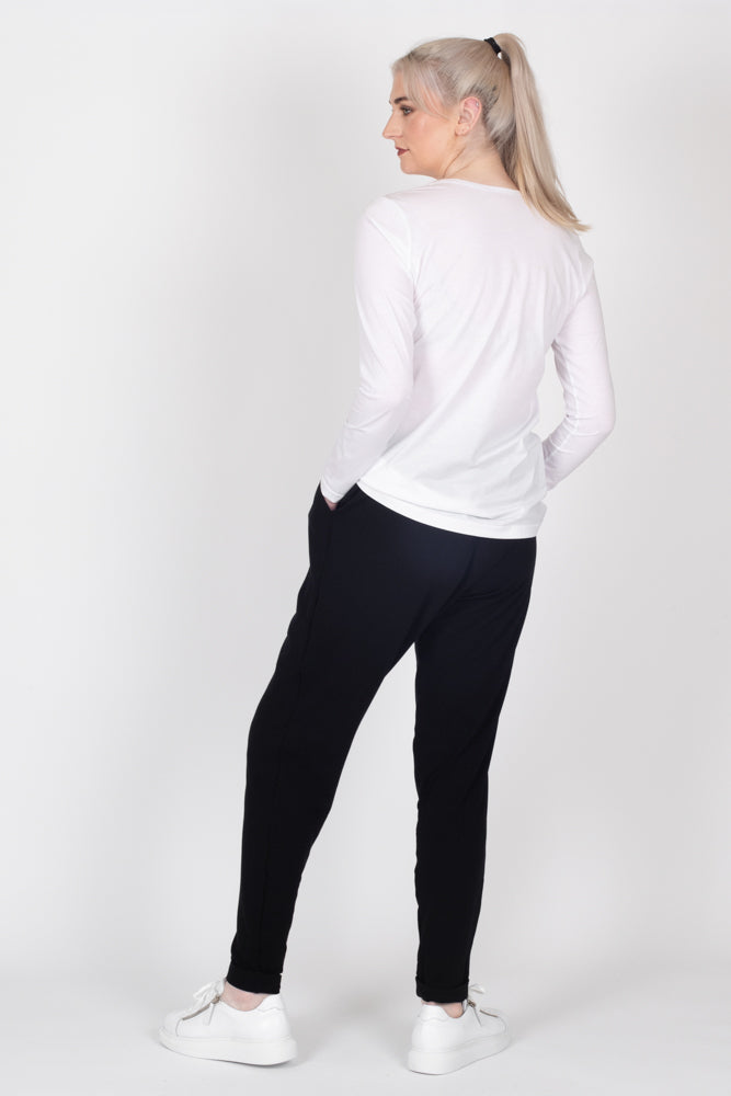 Tall model wearing Freida Pants Black, back