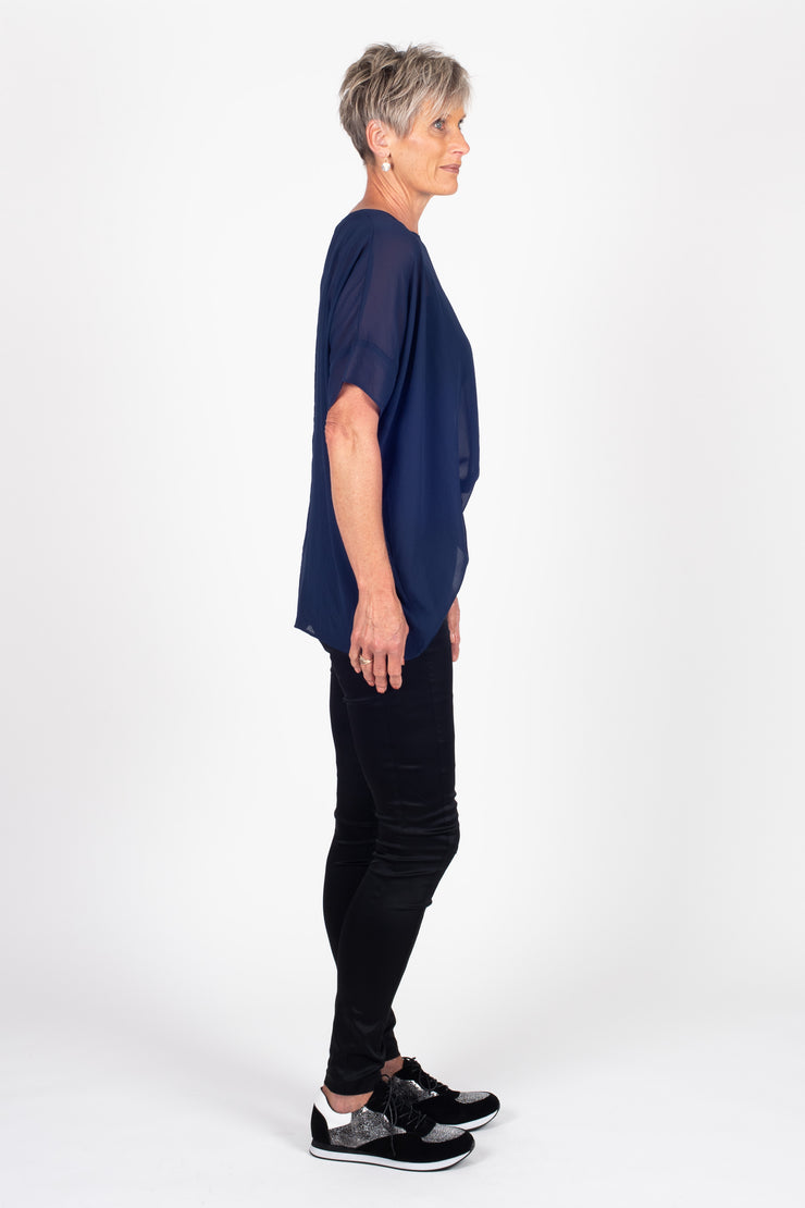 Tall model wearing Breezy Top Sapphire, side