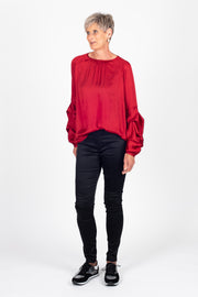 Tall model is wearing Tiered Shirt Red