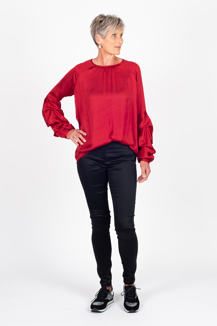Tall model is wearing Tiered Shirt Red