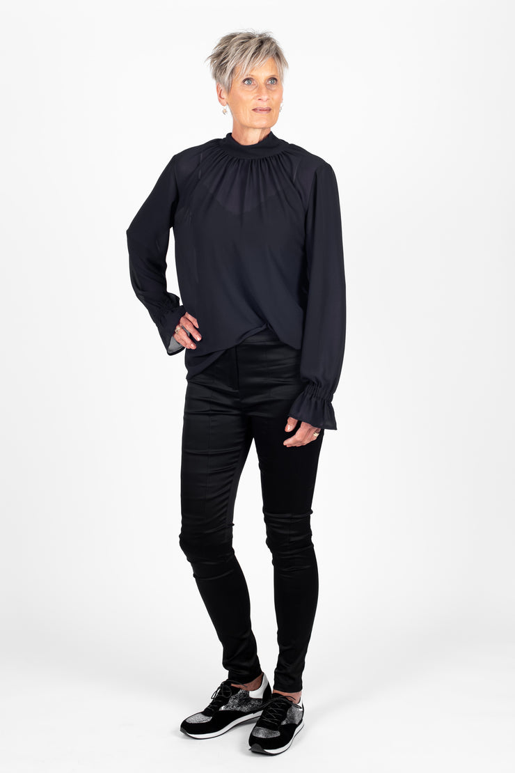 Tall model wearing Millie REVERSIBLE Top Black, front 1