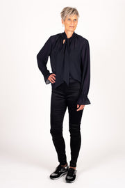 Tall model wearing Millie REVERSIBLE Top Black, front 2 with tie detail