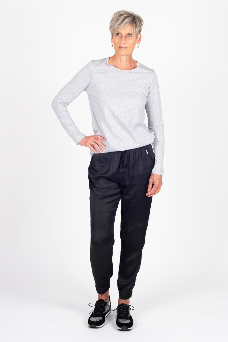 Tall model wearing Side Swipe Relax Pant Black Stripe