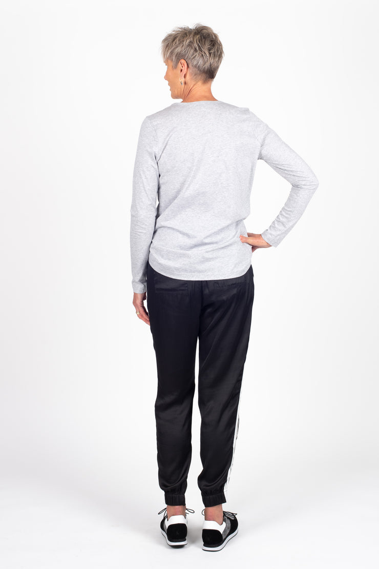 Tall model wearing Side Swipe Relax Pant Black Stripe, back