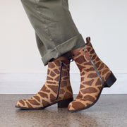 Model wearing Babouche Lifestyle Vida Giraffe Print Ankle boots