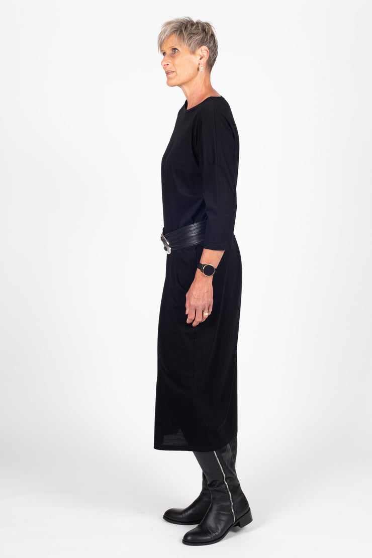 Tall model wearing Lulu Dress Black, side with belt