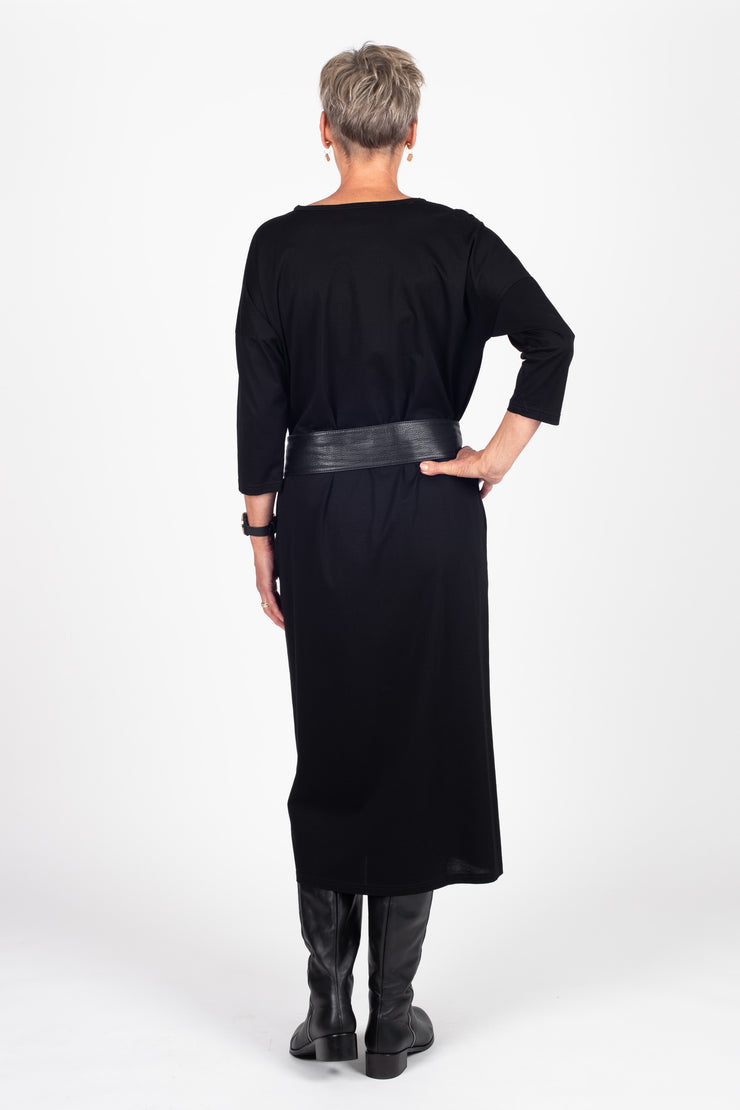 Tall model wearing Lulu Dress Black, back with belt