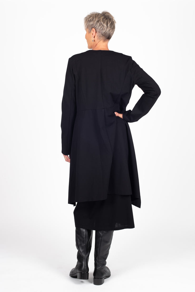 Tall model wearing X Lab Coat Black, back