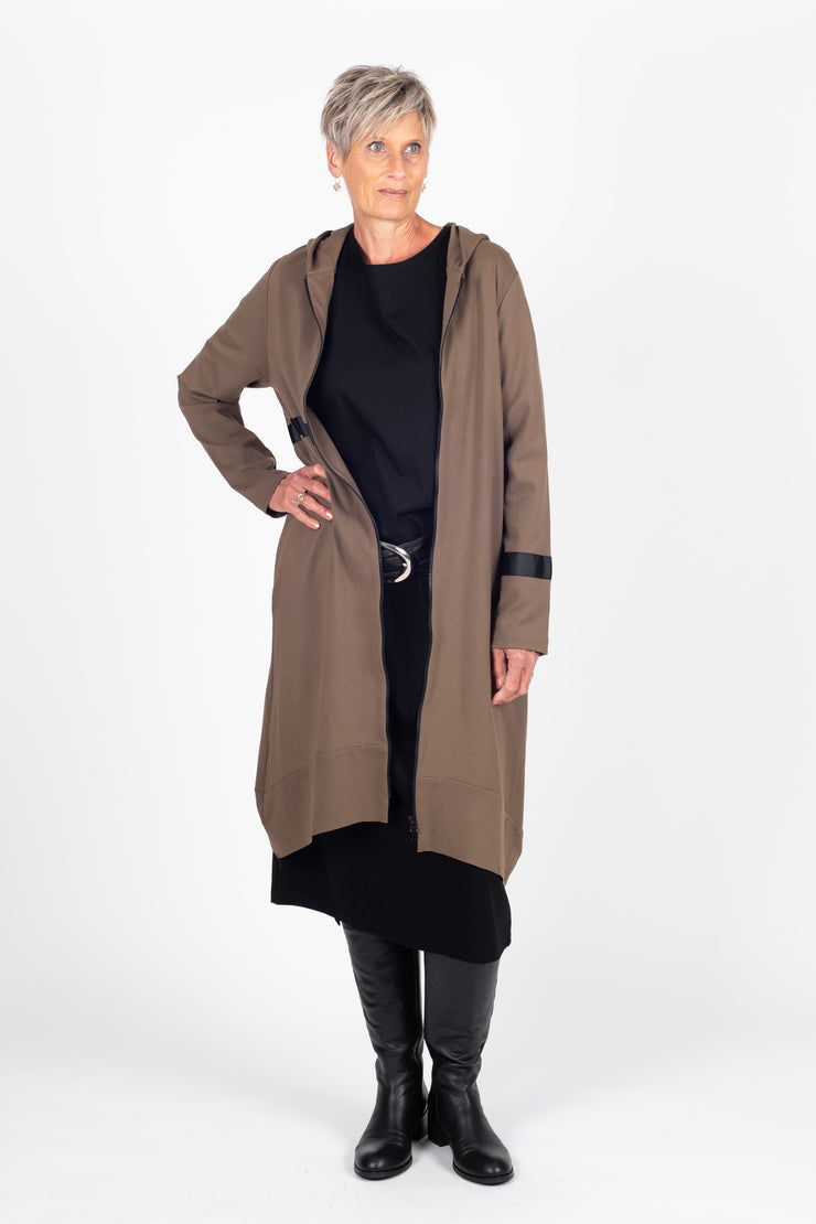 Tall model wearing Eau De Vie Coat Oak, front