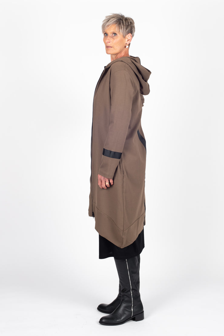Tall model wearing Eau De Vie Coat Oak, side