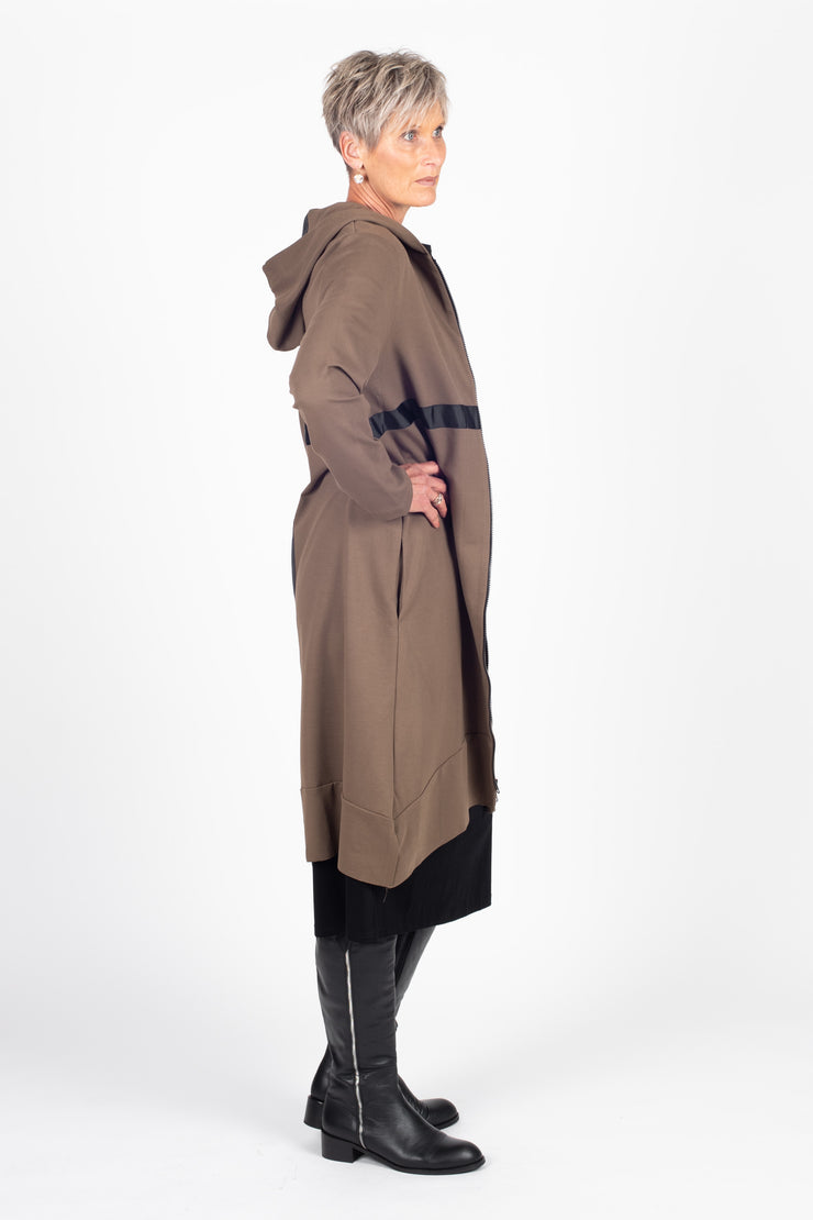 Tall model wearing Eau De Vie Coat Oak, side