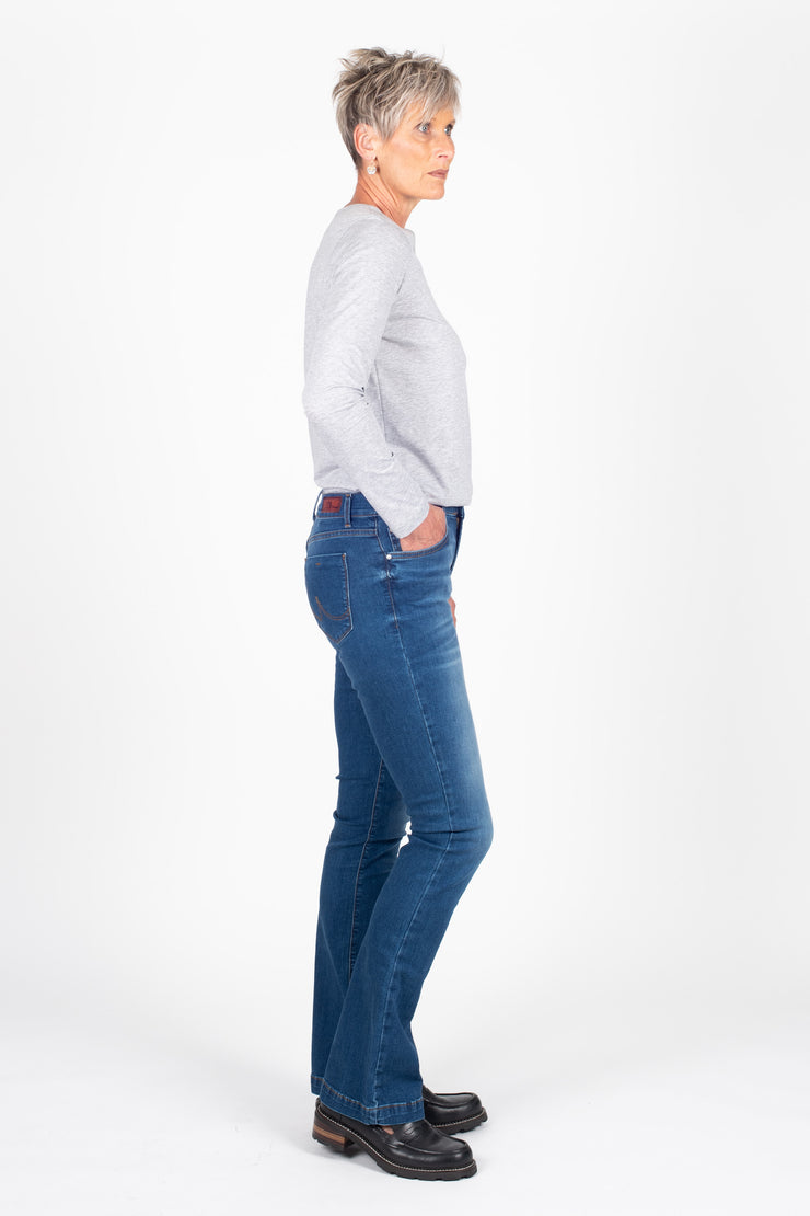 Tall model wearing Fallon Jeans Blue Wash, side