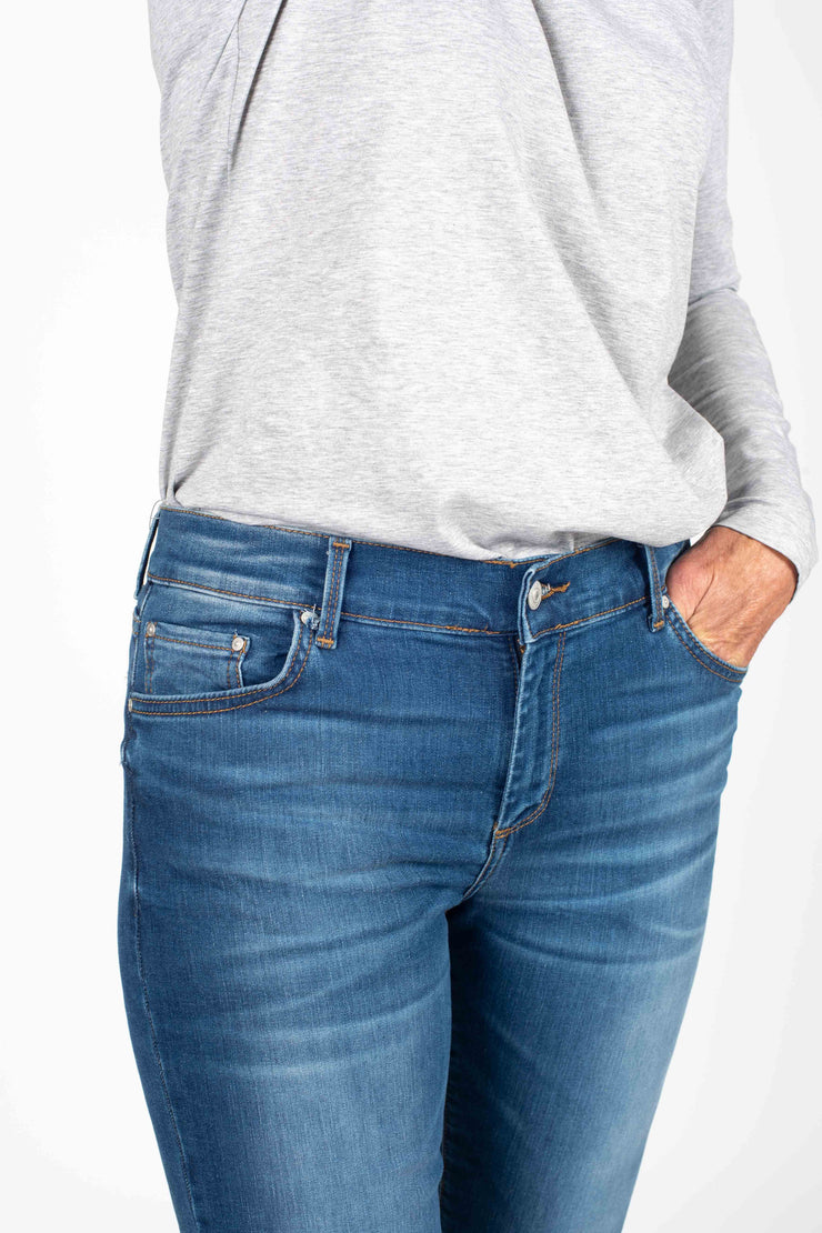 Tall model wearing Fallon Jeans Blue Wash, front close up