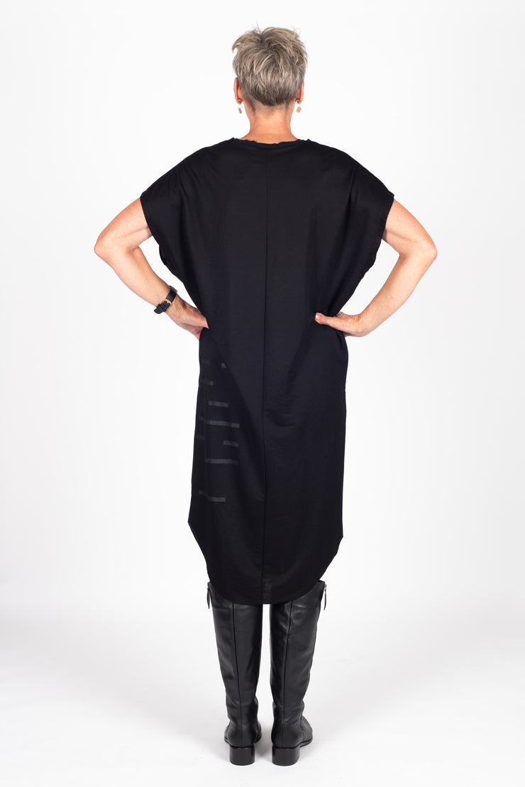Tall model wearing Crossing The Lines Dress Black Black, back