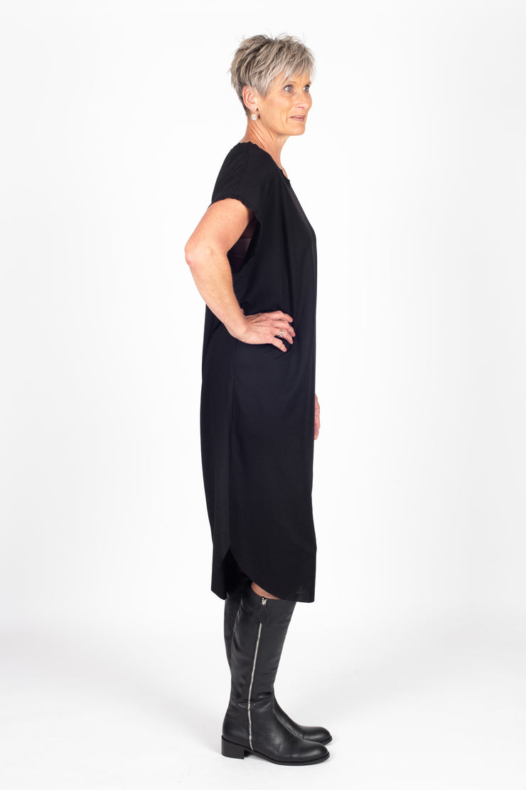 Tall model wearing Crossing The Lines Dress Black Black, side