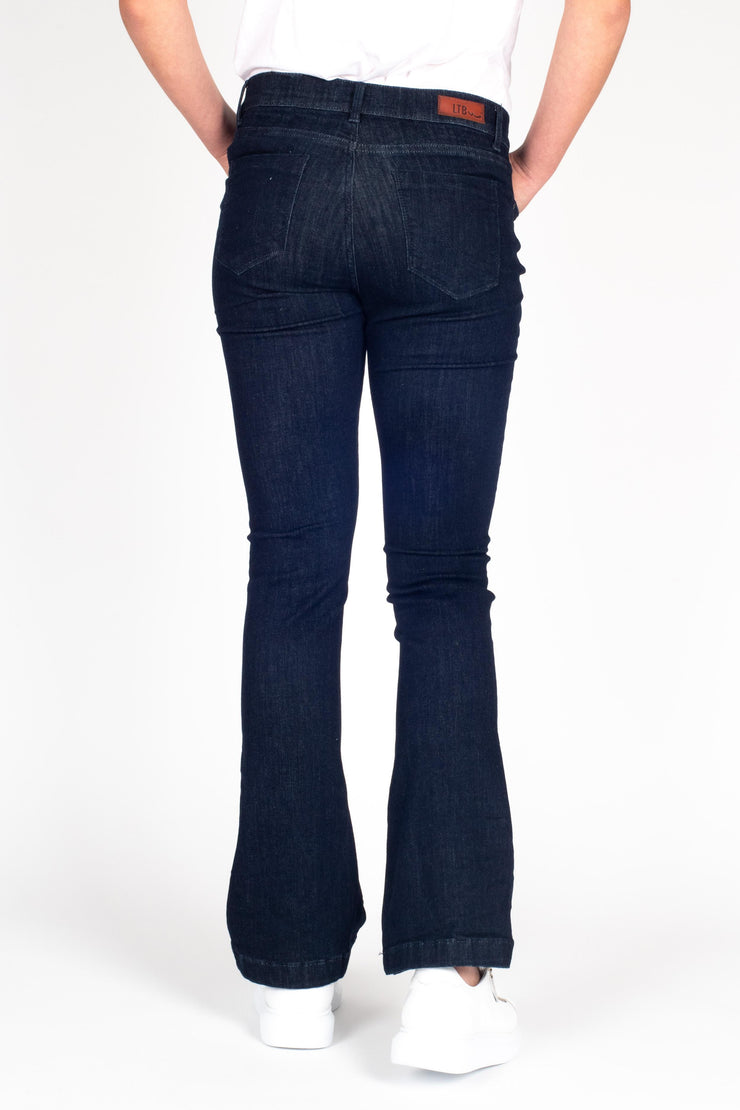 Tall model wearing Fallon Jeans Blue, back