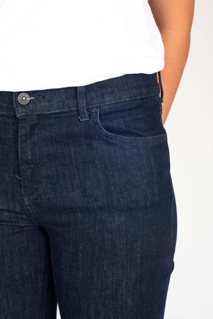 Tall model wearing Fallon Jeans Blue, front pocket detail