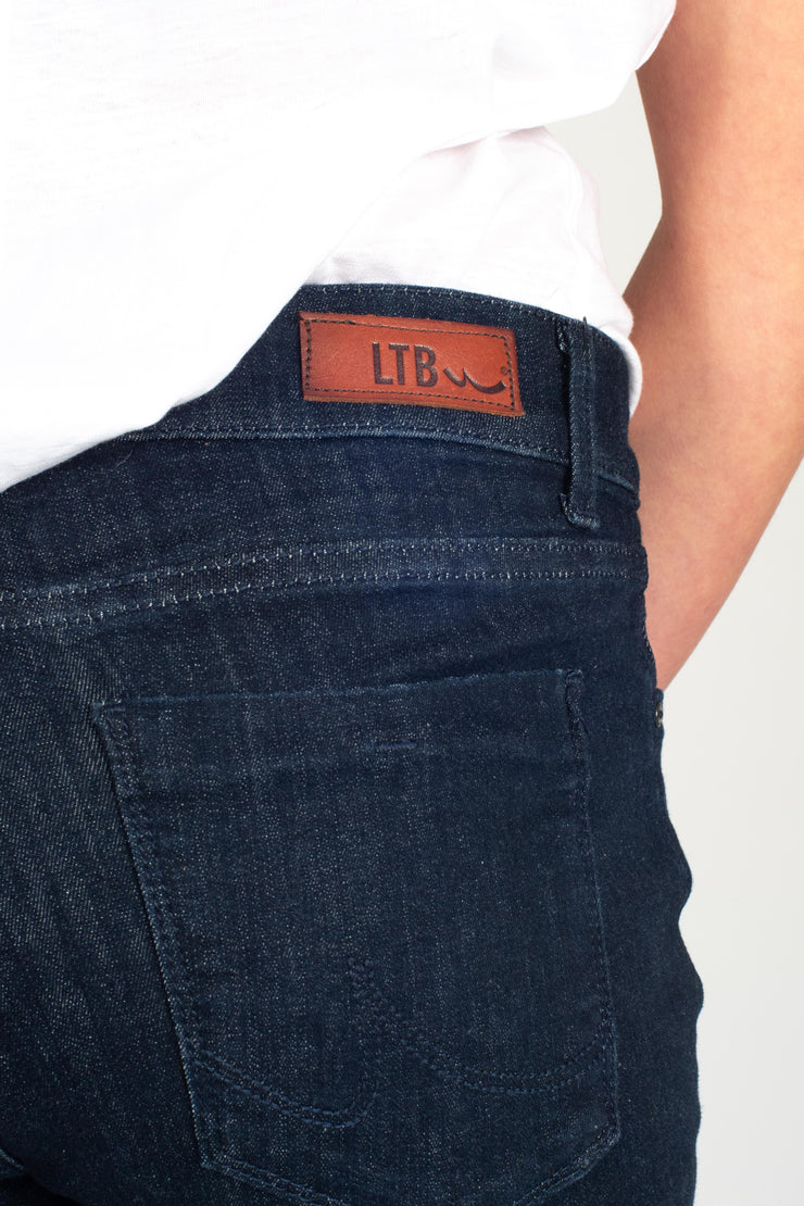 Tall model wearing Fallon Jeans Blue, back pocket detail