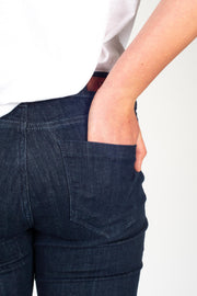 Tall model wearing Fallon Jeans Blue, back pocket detail 2