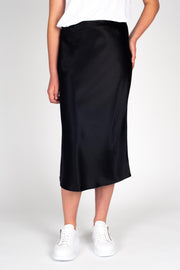 Model wearing Liquid Skirt Black Satin, front