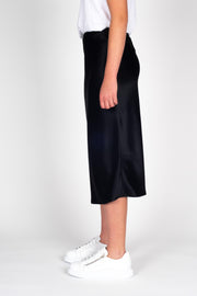 Model wearing Liquid Skirt Black Satin, side
