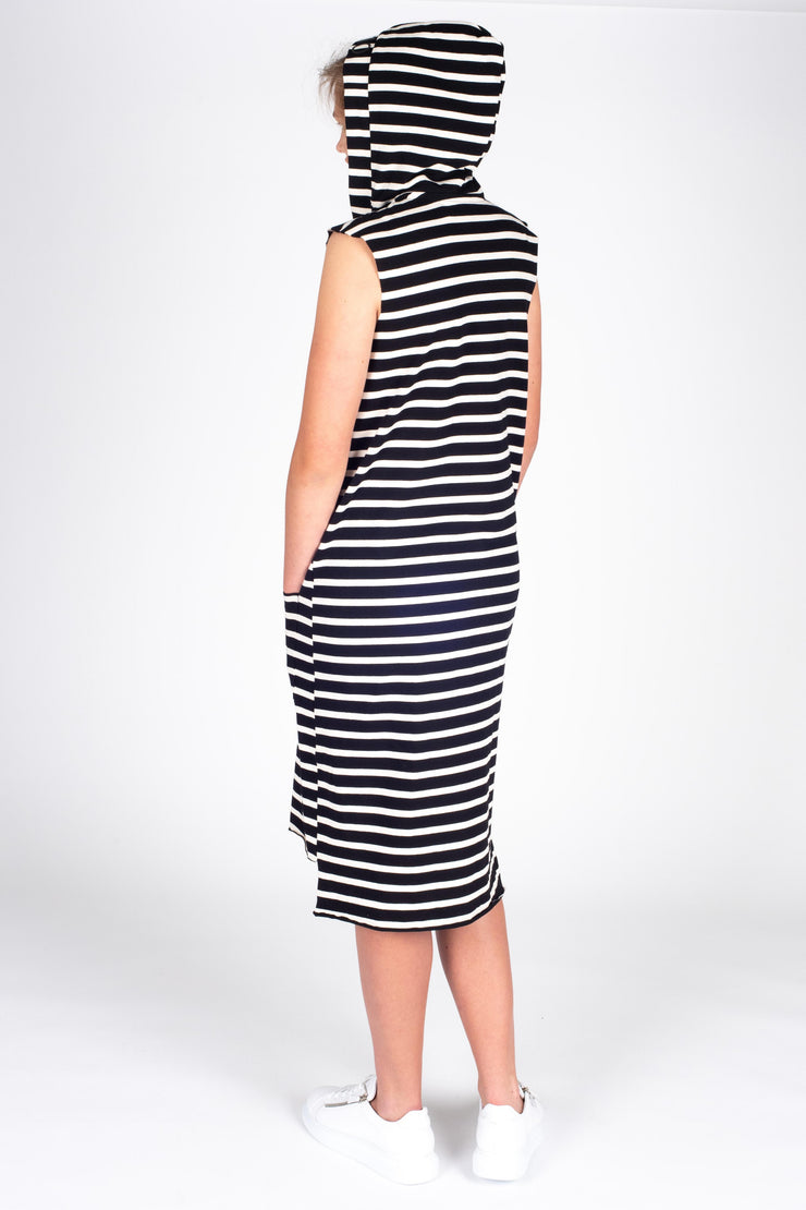 Tall model wearing Boundaries Dress Black Stripe, back hood up