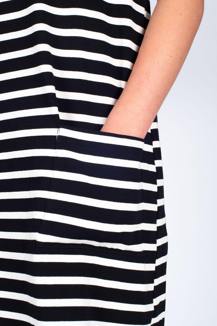Tall model wearing Boundaries Dress Black Stripe, front pocket detail 2