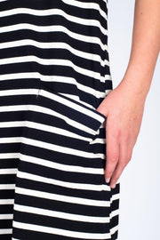 Tall model wearing Boundaries Dress Black Stripe, front pocket detail