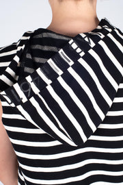 Tall model wearing Boundaries Dress Black Stripe, back hood detail