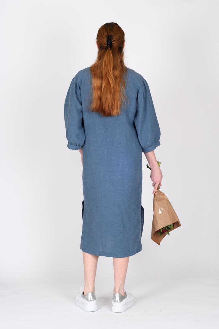 Back view of tall model with flowers wearing Begin Dress Denim for tall women