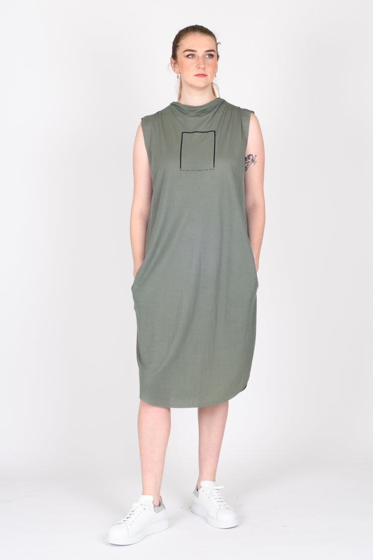Tall model wearing Out of Box Dress Sage for tall women