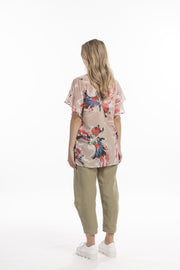 Model showing back of Style X Lab Fly Away Top in Red Print. Made longer for tall women