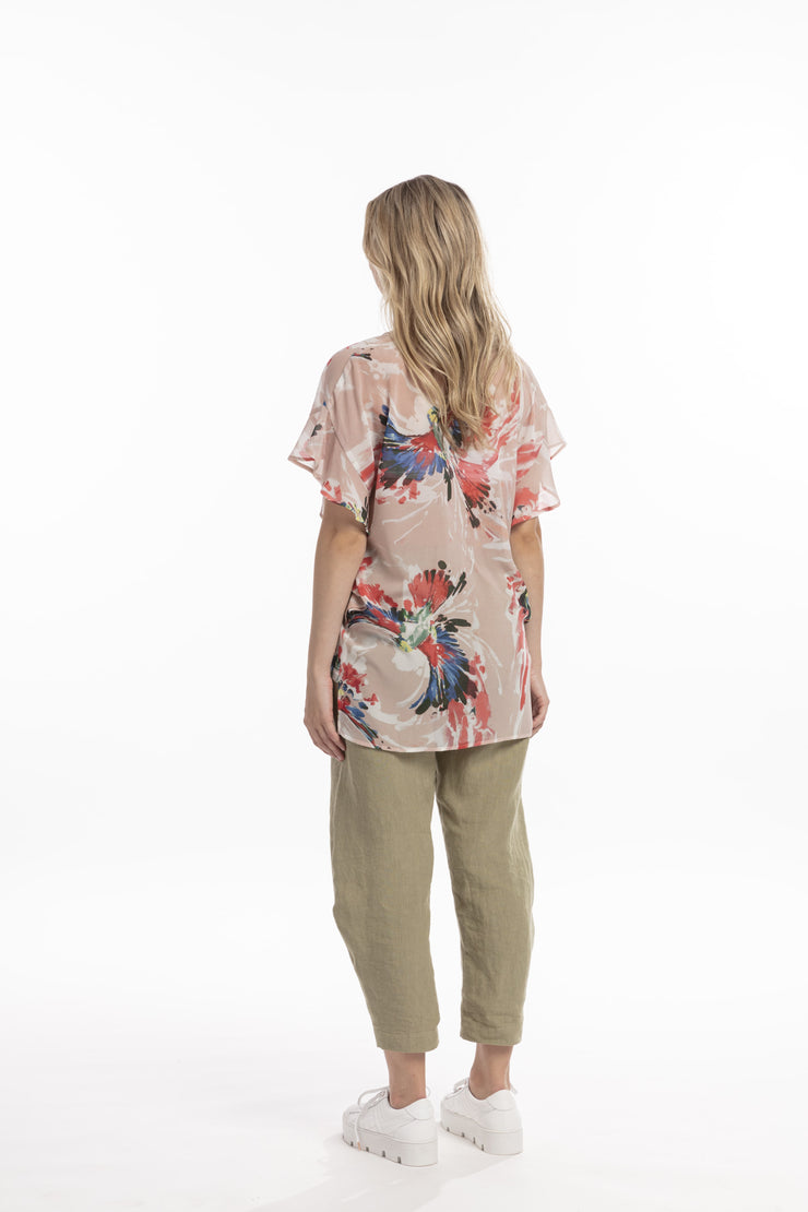 Model showing back of Style X Lab Fly Away Top in Red Print. Made longer for tall women