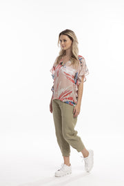 Model in Style X Lab Fly Away Top in Red Print. Made longer for tall women