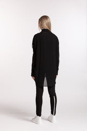 Back view of model wearing Stars Crossed Top Black