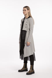 Tall woman wearing X Lab Coat Grey side view