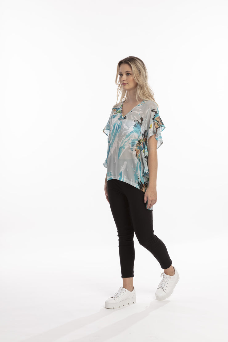 Model wearing Style X Lab Fly Away Top in Turquoise Print. Made longer for tall women
