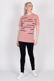 Tall model wearing Crossing The Lines Tee Rose, front