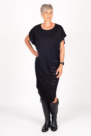 Tall model wearing Crossing The Lines Dress Black Black, front