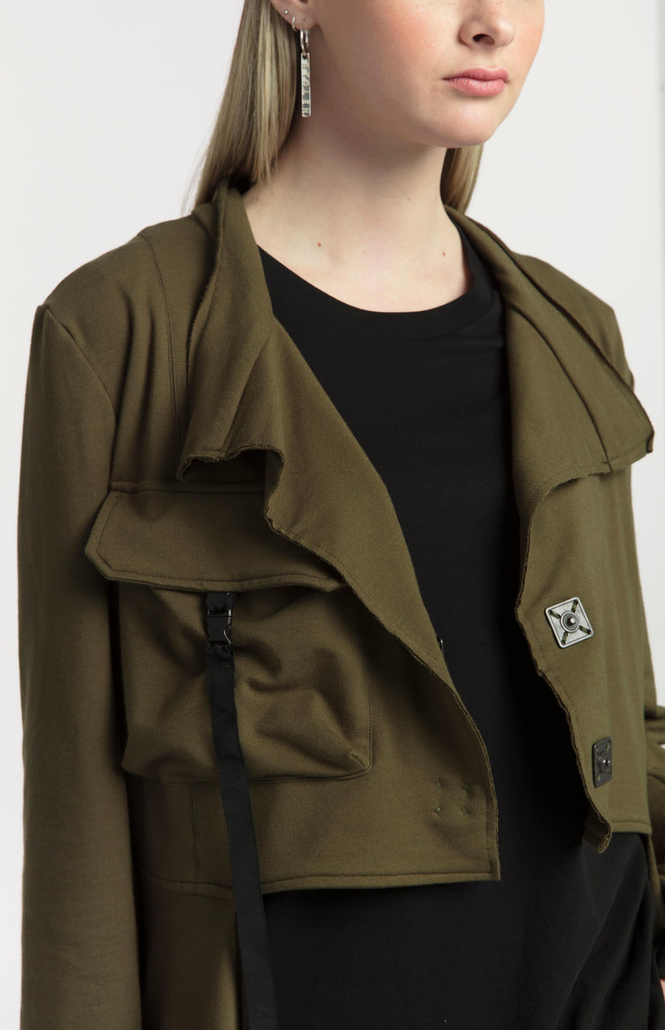 Tall model wearing New Page Coat Olive, close up