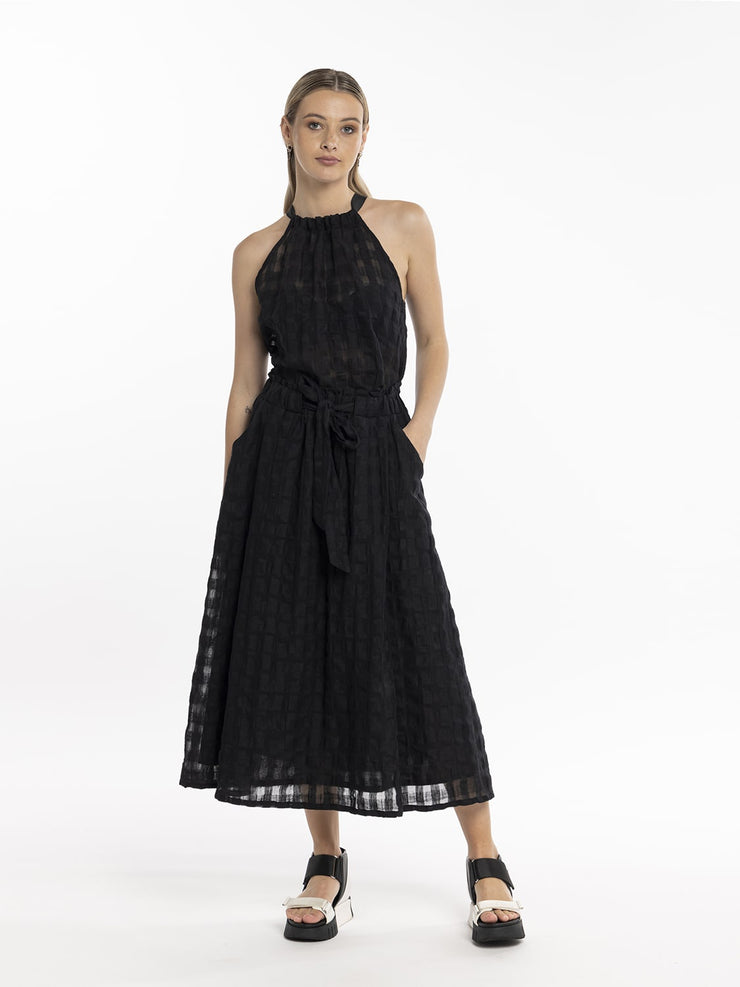 Model in Style X Lab Refraction Skirt Black made longer for tall women